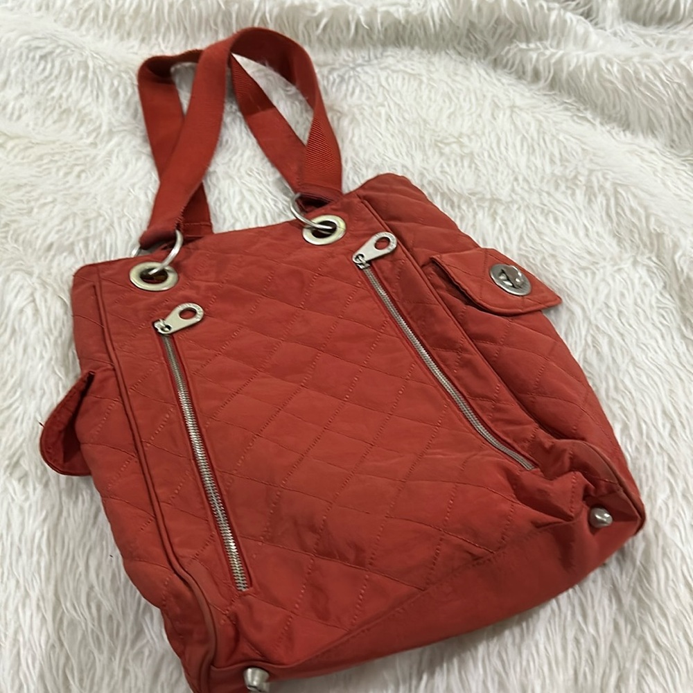 Baggallini orange traveling bag